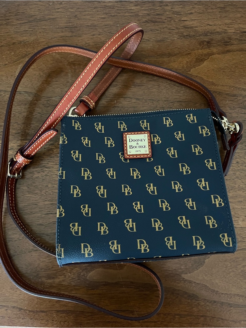 Dooney & Bourke Navy Logo Crossbody with Brown Leather Strap